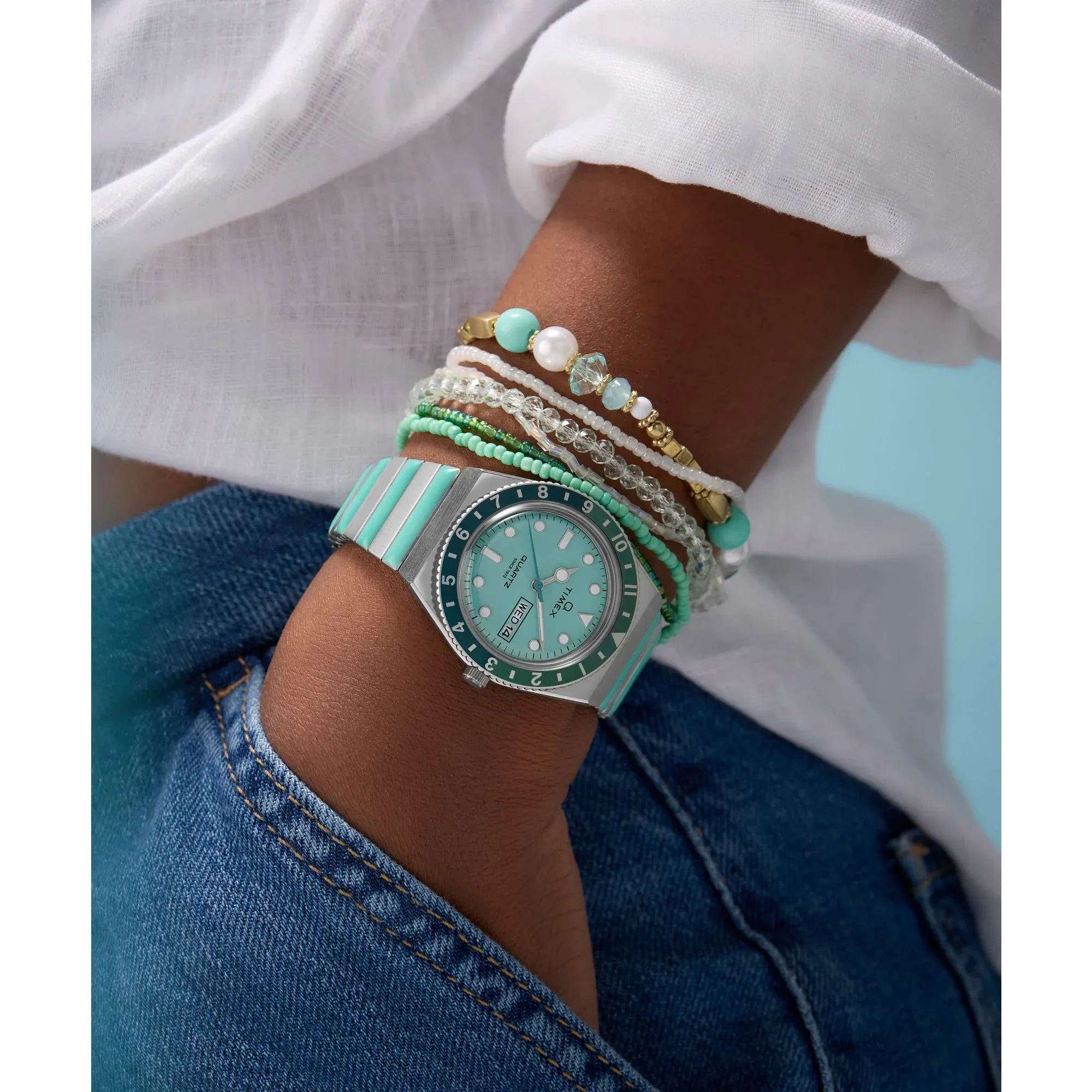 Q Timex TW2W87800UJ with aquamarine dial and pastel two-tone expansion band