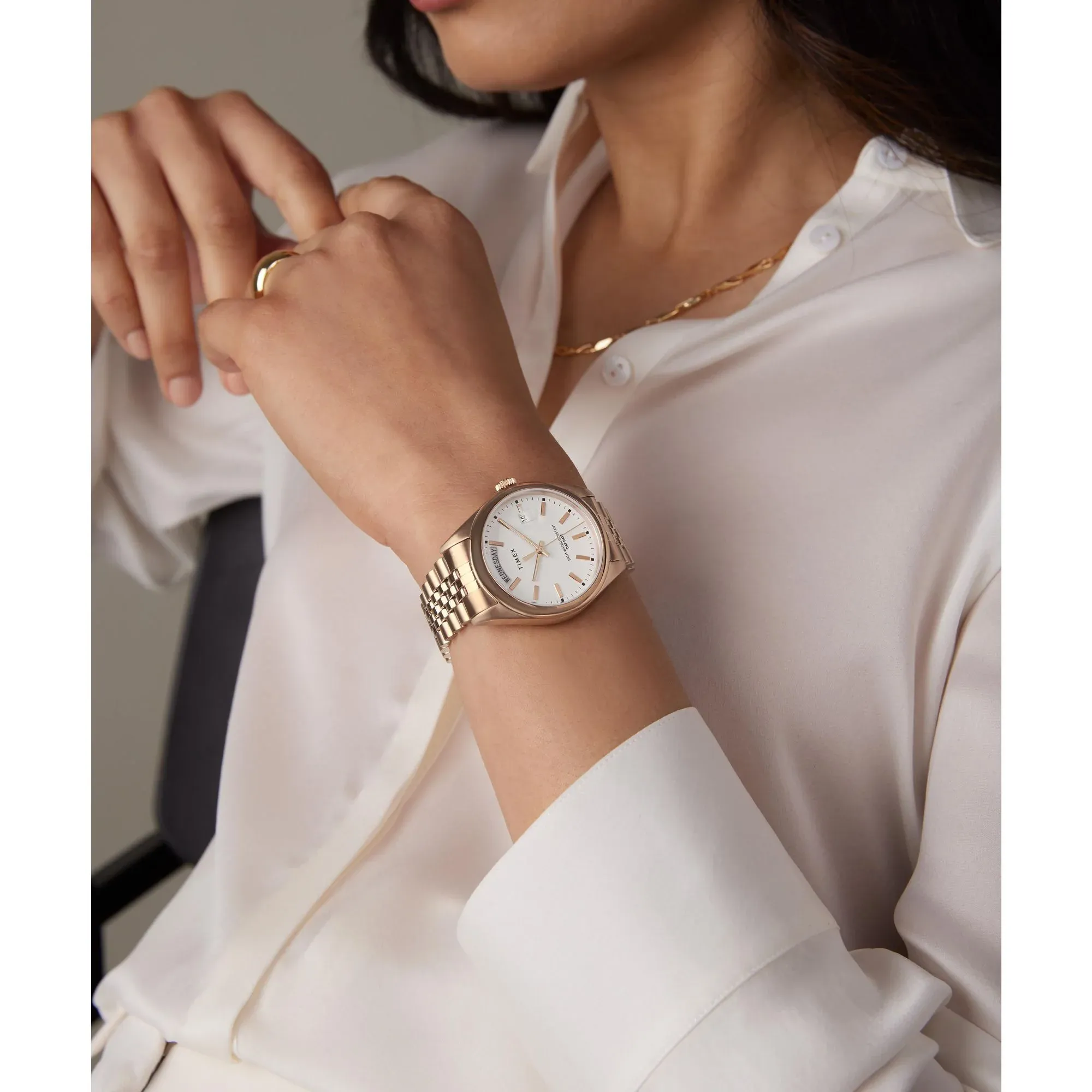Timex TWEL21401 with white dial, rose-gold-tone bracelet and day window